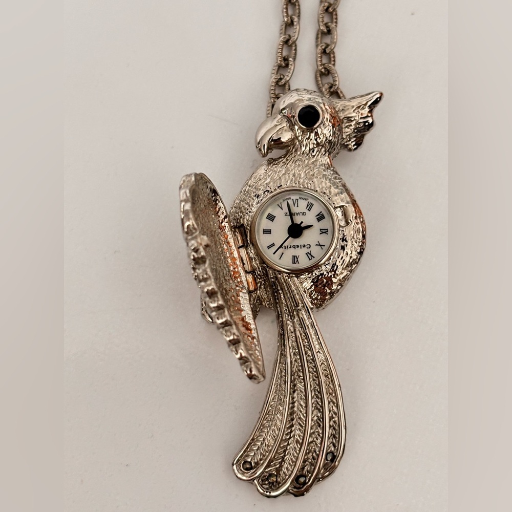 Celebrity brand pocket watch necklace, representing a parrot or cockatoo RARE